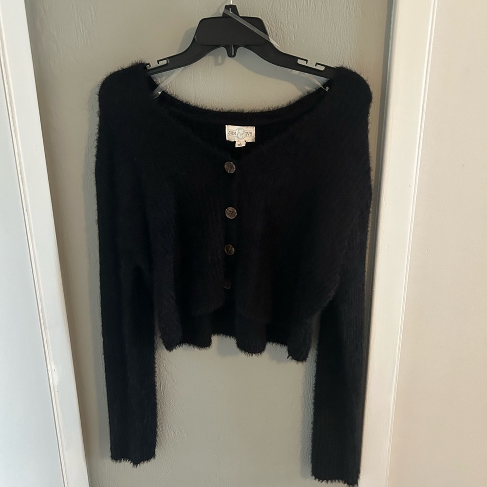 Francesca’s black buttoned sweater